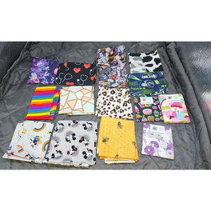 Large mixed lot of cotton fabric squares / fat-quarter–style pre-cuts